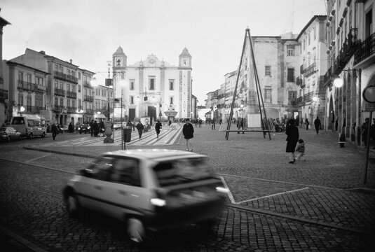 Fototapeta Car Driving on Street near Buildings, Evora, Portugal
