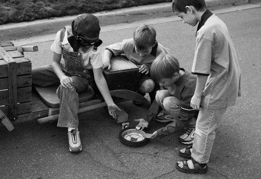 Group of Children Building Soapbox Car