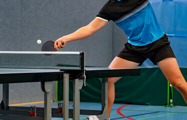 close up of table tennis player returning the ball - obrazy, fototapety, plakaty