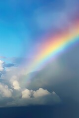 Naklejka na ściany i meble a rainbow with clouds in the sky