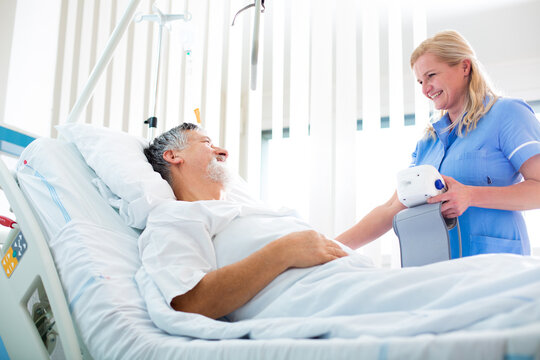 Senior male patient in a modern hospital (shallow DOF; color toned image)