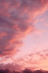 Naklejka na ściany i meble a pinkish sunset with clouds on high octane backgrounds
