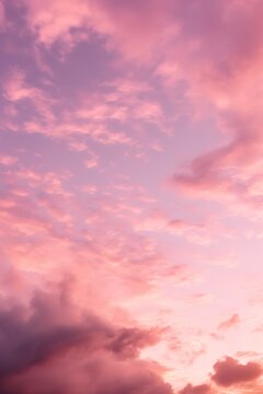 some clouds are over a pink sky
