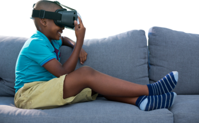 Boy smiling while using virtual reality simulator