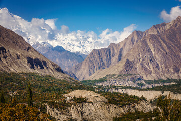 Breathtaking beauty of Hunza Valley and the majestic Karakorum Mountains, where the crystal-clear Hunza River winds its way through stunning landscapes.