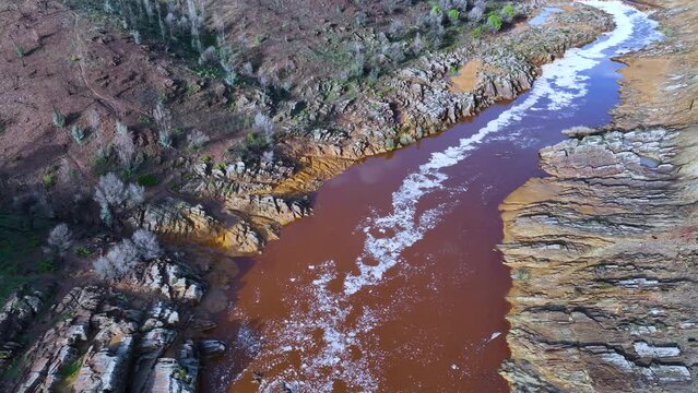 Rio Tinto textures. Aerial view from a drone in the surroundings of the town of Berrocal. Sierra Morena, Gulf of C&aacute;diz, Huelva, Andalusia, Spain, Europe