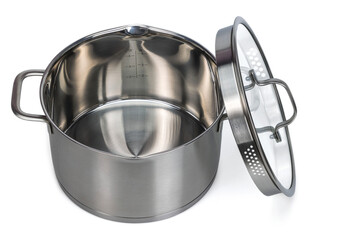 Close-up view of open 4 liter stainless steel saucepan with glass lid on white background. Sweden.