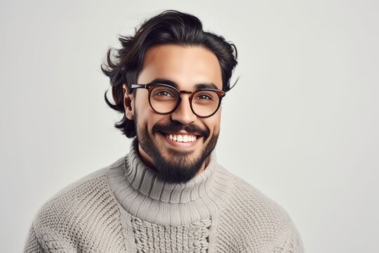 Medium shot portrait photography of a grinning, man in his 30s wearing a cozy sweater against a white background. Generative AI