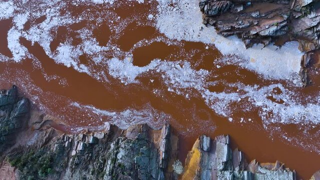 Rio Tinto textures. Aerial view from a drone in the surroundings of the town of Berrocal. Sierra Morena, Gulf of C&aacute;diz, Huelva, Andalusia, Spain, Europe