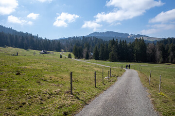 People walking near Les Pléiades in Vaud, Switzerland