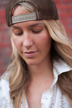 Close-up Portrait of Woman wearing Baseball Hat
