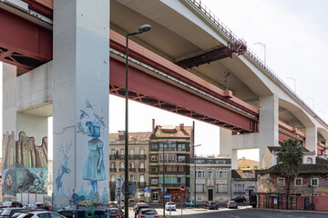 March 12, 2023 Lisbon, Portugal: the 25th of April Bridge and graffiti painted on the bridge beam