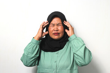 Unhealthy Middle aged Asian women wearing hijab feels so dizzy suffering from headache and migraine