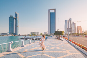 Strolling along the Abu Dhabi Corniche, a scenic waterfront promenade with stunning views of the Arabian Gulf and the city's iconic skyscrapers, is a must-do for any visitor to the UAE's capital. © EdNurg