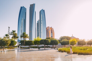 Towers skyscrapers with hotels and office and residential buildings in Abu Dhabi city, UAE. Real estate and landmarks - obrazy, fototapety, plakaty