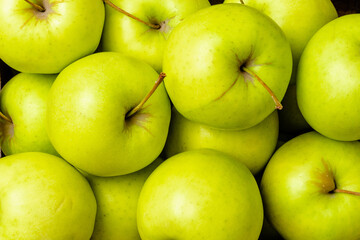 Green apples on black table