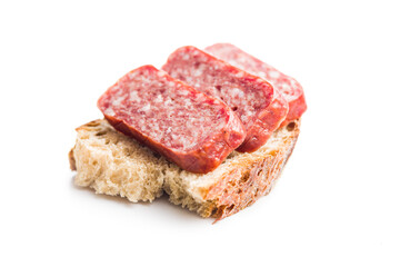 Smoked sausage. Sliced salami and bread isolatd on white background.