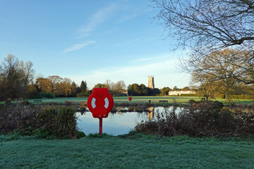 Lifebuoy on the edge of a Cirencester lake in the Cotswolds. UK