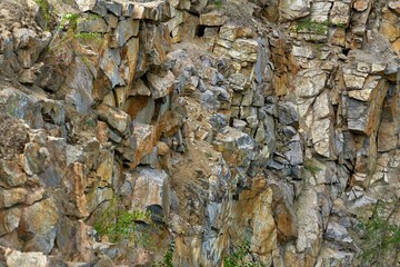 Granite rock, steep slope in the mountains.