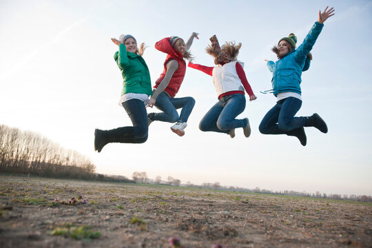Teenagers Jumping in the Air