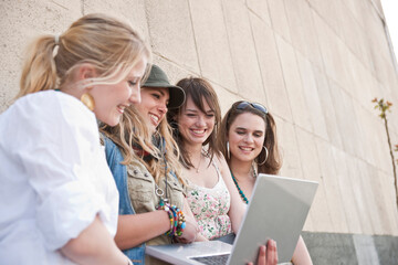 Young Women Using Laptop Computer