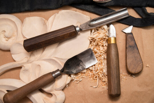 Tools for hand-crafting wood - artistic woodworking, carving pictures, various artistic wood products, top view, close-up