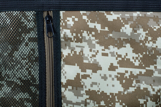 Part of military camouflage protective suit, close up, protection concept
