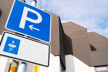 Blue vehicle parking sign with time parking meter and copy space for text