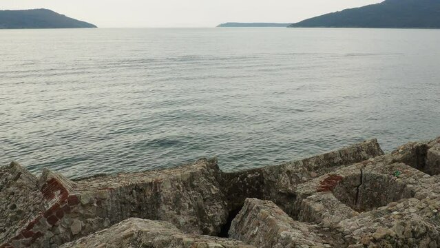 Fort Mezaluna Mesaluna Citadel Citadela Montenegro Herceg Novi. The ruins of an ancient stone fortress, destroyed in an earthquake, fell into the Adriatic Sea, the Mediterranean. Tourist attractions