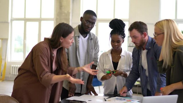 Group of professional diverse male and female employees discussing startup project have arque about ideas, multiracial entrepreneurs communicate during collaboration teamwork
