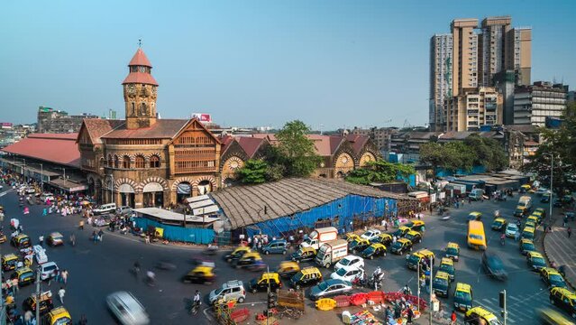 Time lapse view of traffic around historic landmark Crawford Market in Mumbai, Maharashtra, India. 