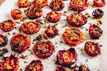 Cooked Sun Dried Tomatoes with Olive Oil, Garlic and Thyme on Baking Paper