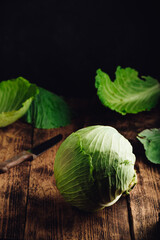 Whole White Cabbage on Wooden Table