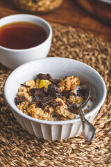 Bowl of Granola with Crushed Chocolate and Cup of Coffee