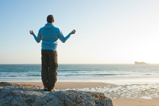 Man Meditating at the Beach, Camaret-sur-Mer, Crozon Peninsula, Finistere, Brittany, France