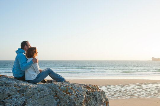 Mature Couple Looking into the Distance on the Beach, Camaret-sur-Mer, Crozon Peninsula, Finistere, Brittany, France