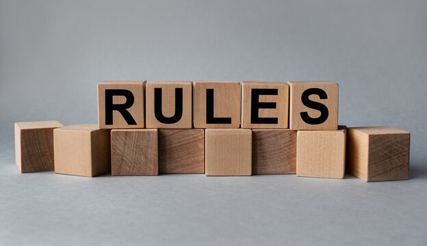 RULES, the inscription on wooden cubes on a white background