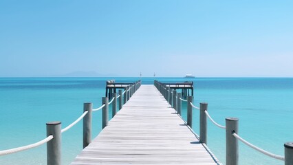 The Endless Horizon: A Majestic View of the Sea from the White Boardwalk Pier
