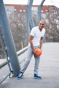 Portrait of Man Outdoors, Playing Basketball, Mannheim, Baden-Wurttemberg, Germany