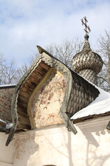 cross on the wooden dome and old wooden roof 
