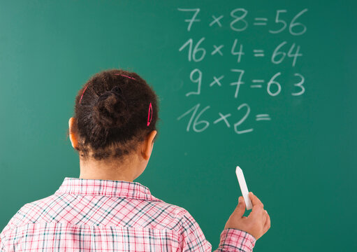 Girl Answering Question at Blackboard in Classroom, Baden-Wurttemberg, Germany