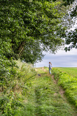 A woman with a dog on a walk