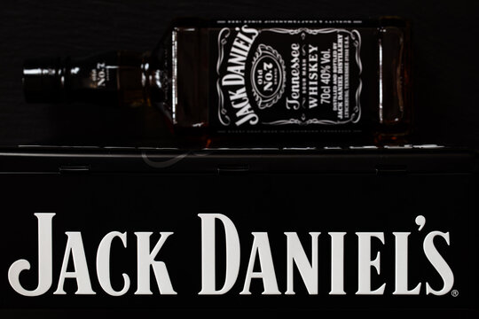 Jack Daniel's bottle and metal box gift on black background