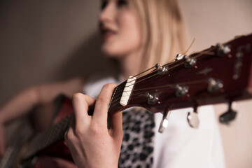 Woman Playing Acoustic Guitar