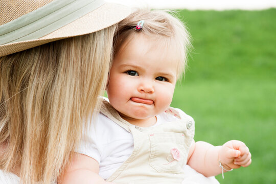 Portrait of Baby Girl Making Faces with Mother, Mannheim, Baden-Wurttemberg, Germany