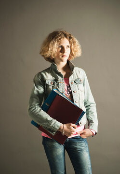Portrait of Teenage Girl with Binders, Studio Shot