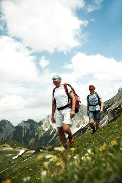 Mature couple hiking in mountains, Tannheim Valley, Austria