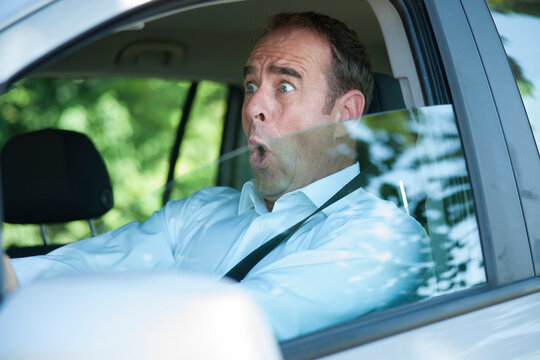Surprised Businessman Driving Car, Mannheim, Baden-Wurttemberg, Germany