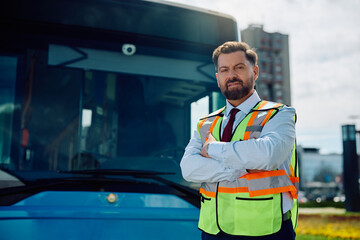Portrait of confident bus driver looking at camera. © Drazen