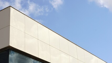 Fototapeta na wymiar cornice of modern facade against blue sky